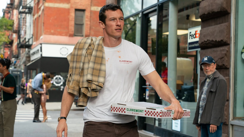 Owen carries a pizza on his hip and a flannel shirt flung over his shoulder in One Night Only
