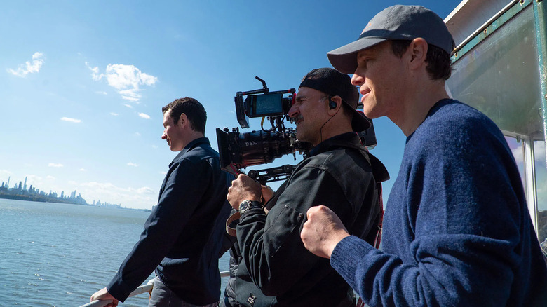 Will Gluck on set with Callum Turner and a camera operator filming One Night Only