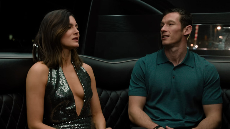 Allie and Owen sitting in a car talking in One Night Only