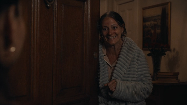 Lucille opening the door in her bathrobe in Match