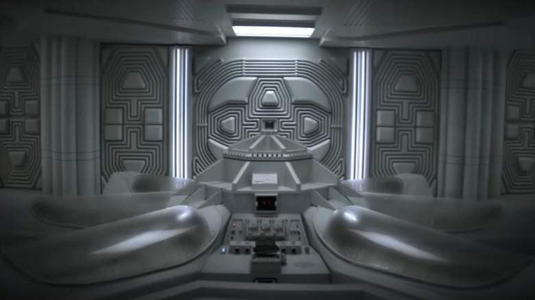 A shot of a white room full of empty cryo-beds in a starship in Alien: Earth