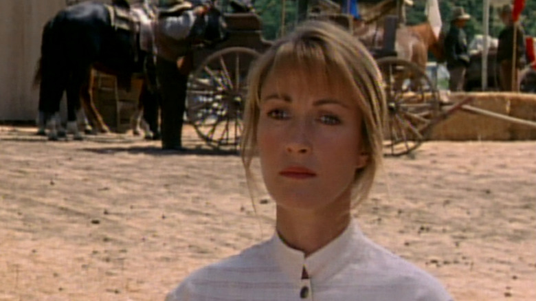 Jane Seymour as Michaela Quinn standing in front of a wagon in Dr. Quinn, Medicine Woman