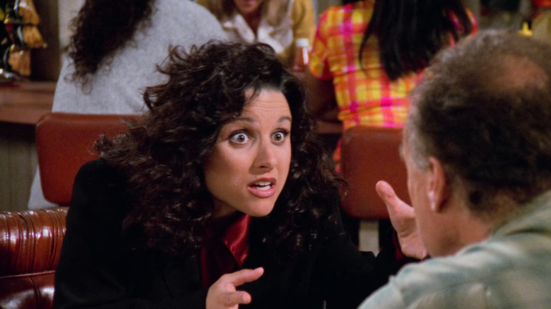 Elaine talking in restaurant in Seinfeld