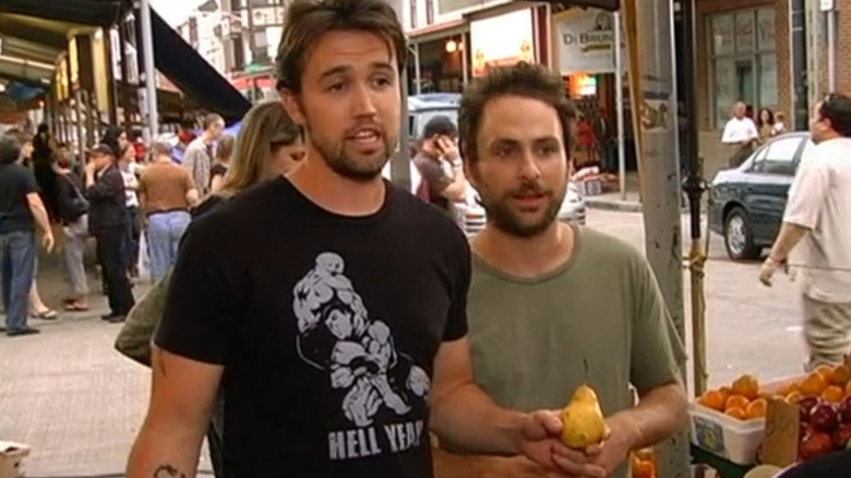 Always Sunny, Mac and Charlie at a market, bartering over a pear