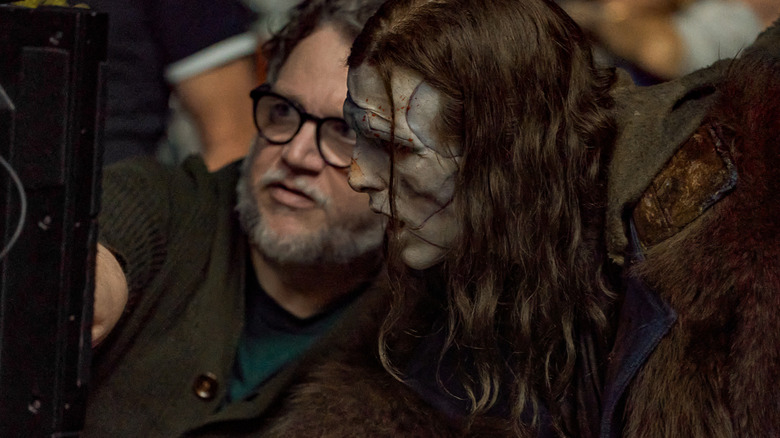 Director Guillermo del Toro with Jacob Elordi as The Creature on the set of Frankenstein