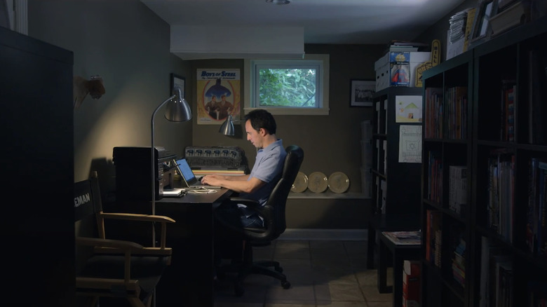Marc Tyler Nobleman sits at a computer in his office in Batman & Bill