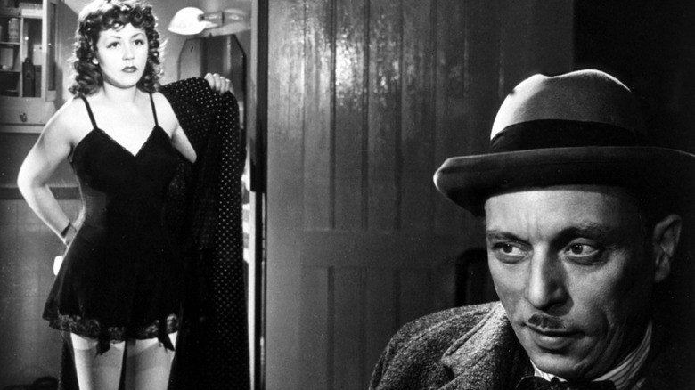 Louis Jouvet as Inspector Antoine interrogates Suzy Delair as Jenny Lamour
