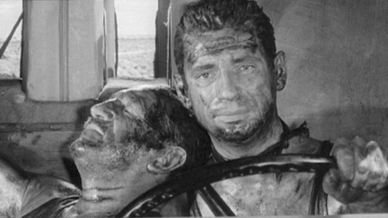 Yves Montand as Mario drives a mortally wounded Charles Vanel as Jo in The Wages of Fear
