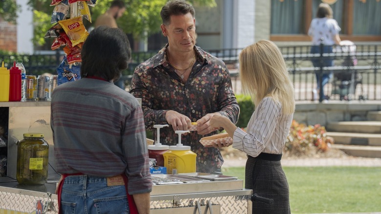 Chris and Harcourt eating hot dogs on Earth X in Peacemaker