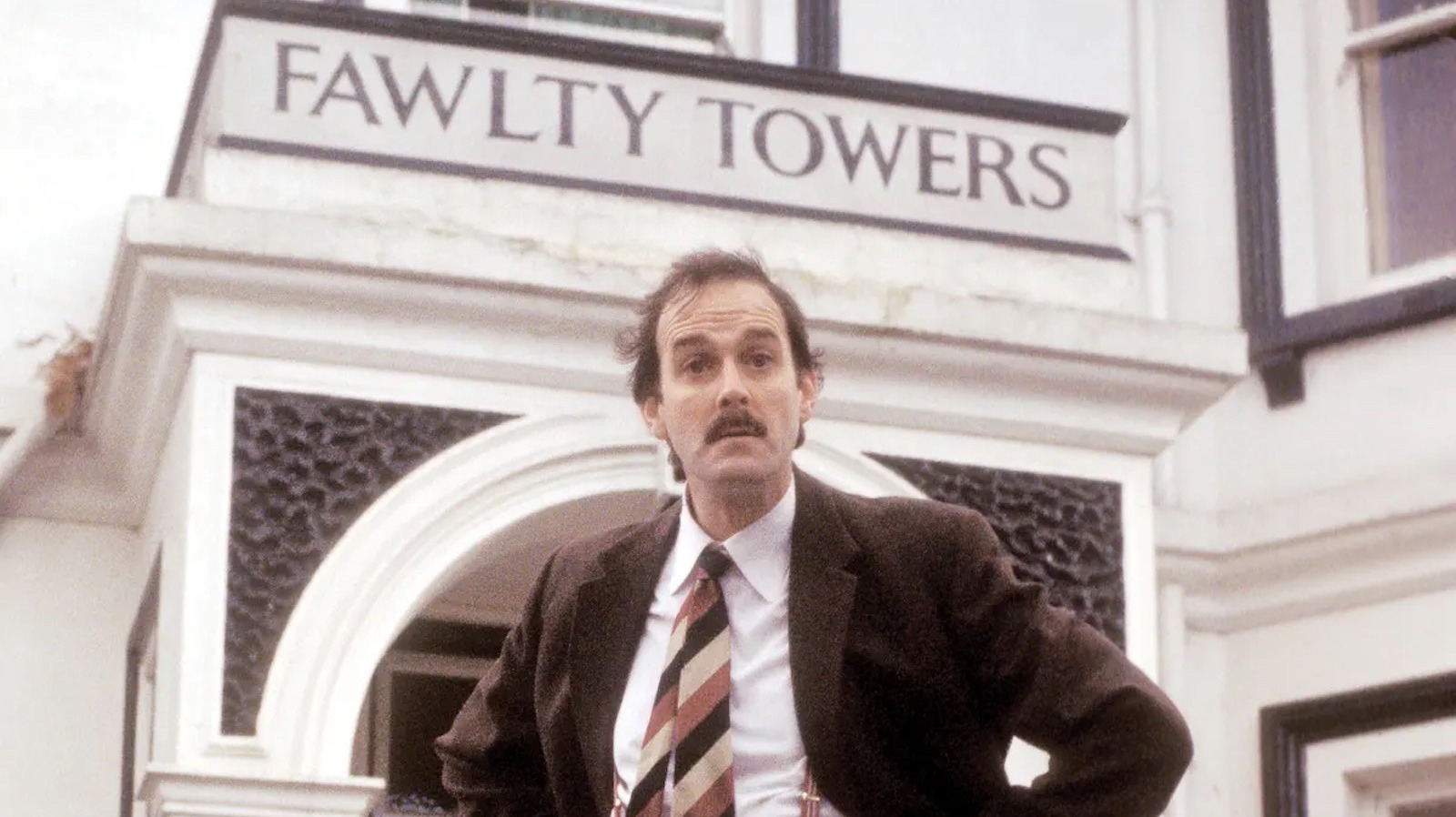 One Of John Cleese's Only Fawlty Towers Regrets Involves Getting Hit