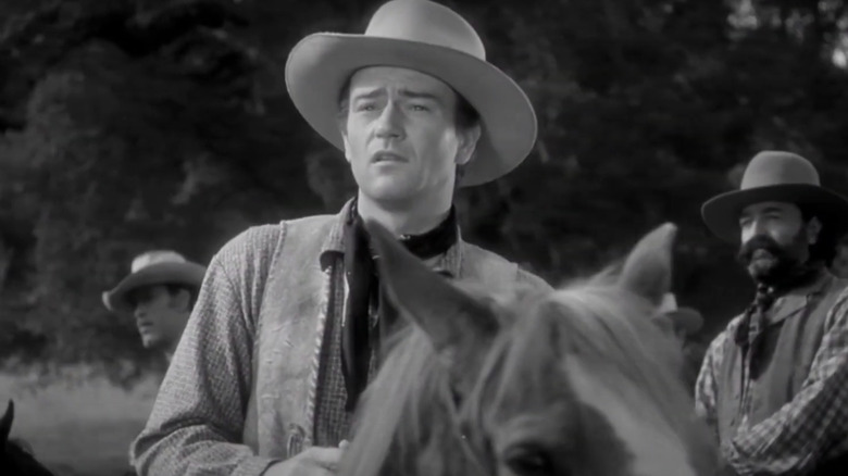 John Wayne's Bob Seton sits on his horse in Dark Command