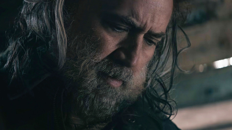 Nicolas Cage as Robin Feld looks down in Pig