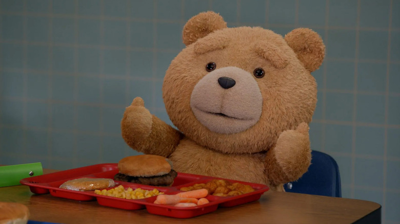 Ted gving a thumbs up during school lunch