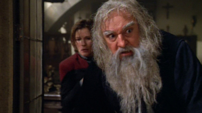 Leonardo da Vinci looking out a window on Star Trek: Voyager, Captain Janeway coming up behind him