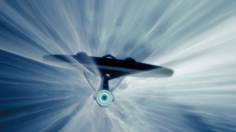The USS Enterprise traveling through warp in Star Trek