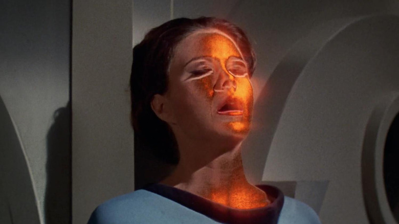 Mira Romaine with a glowing face on Star Trek