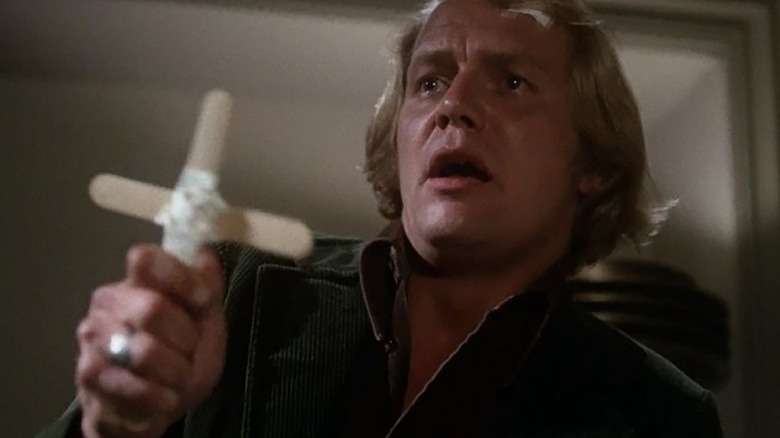 Ben Mears holding a cross in Salem's Lot