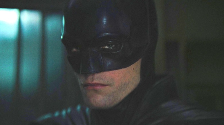 Robert Pattinson as Batman interrogating Riddler in jail in The Batman