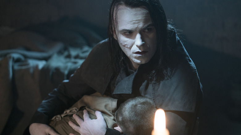 Rory Kinnear as the Creature holding someone in Penny Dreadful