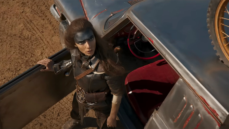 Furiosa looking up from her car