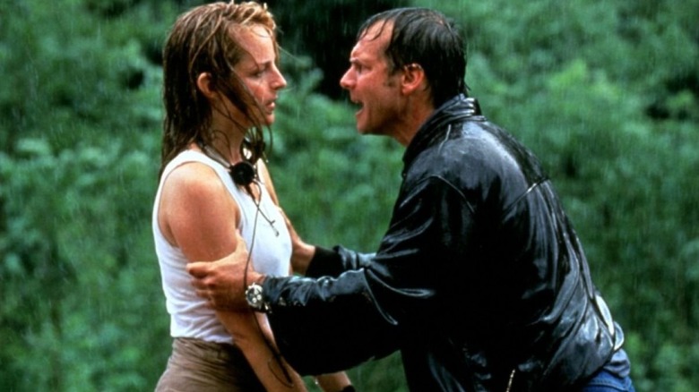 Helen Hunt's Jo being scolded by Bill Paxton's Bill in the rain in Twister