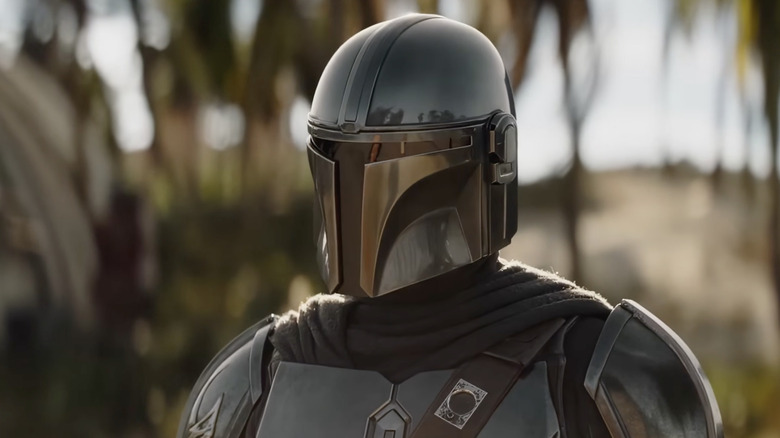 Din Djarin wearing his helmet outside in The Mandalorian and Grogu