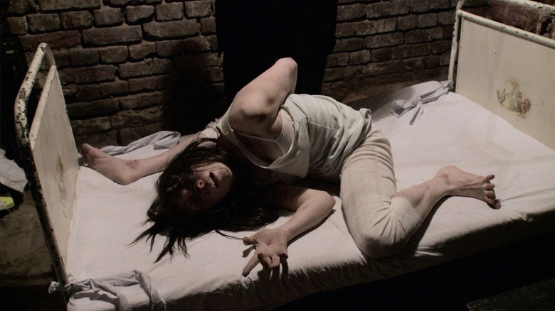 Bonnie Morgan is a possessed, contorted mess as Rosa Sorlini in The Devil Inside