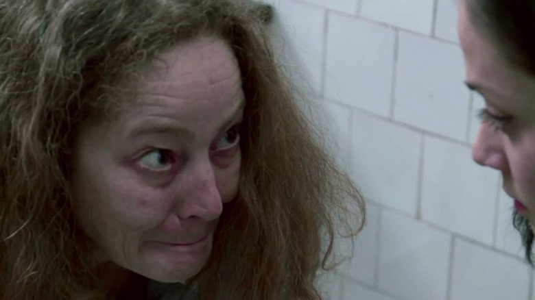 Suzan Crowley as Maria Rossi prepares to scare Fernanda Andrade as Isabella Rossi in The Devil Inside