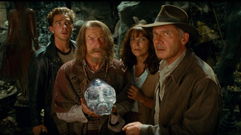 Mutt, Ox, Marion, and Indiana gathered around a crystal skull in Indiana Jones and the Kingdom of the Crystal Skull
