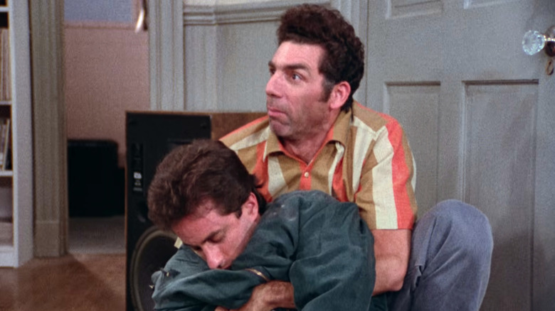 Seinfeld, stunned Kramer holding Jerry's dead body