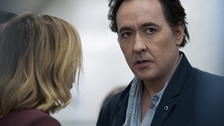 John Cusack's Kevin is a CEO grifter in 2020's Utopia