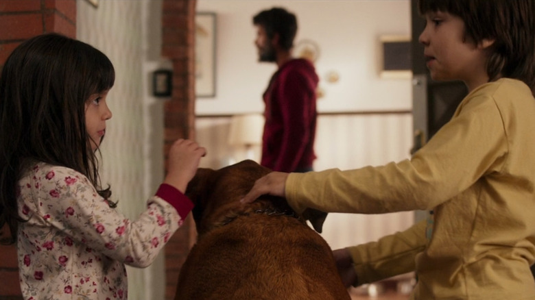 Vicky sits next to dog in When Evil Lurks