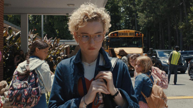 Justine Gandy walks in front of the school where she teaches in Weapons