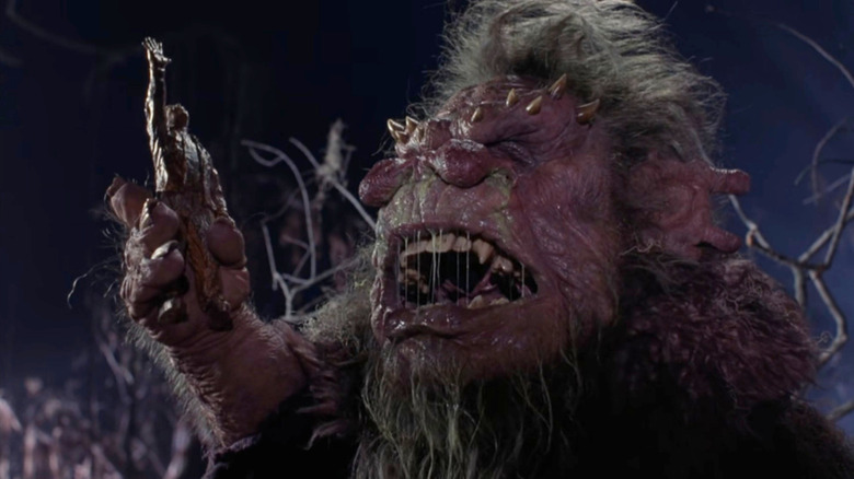 Trantor the Troll holding a wooden figure in Ernest Scared Stupid