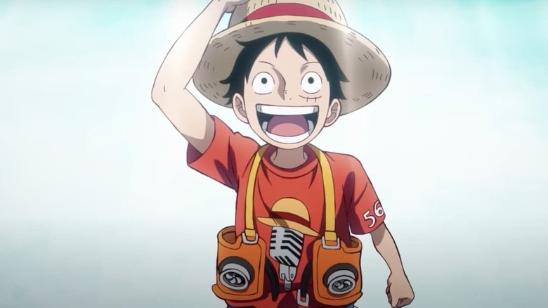 Luffy looks up in wonder while dressed ready for a concert in One Piece Film Red