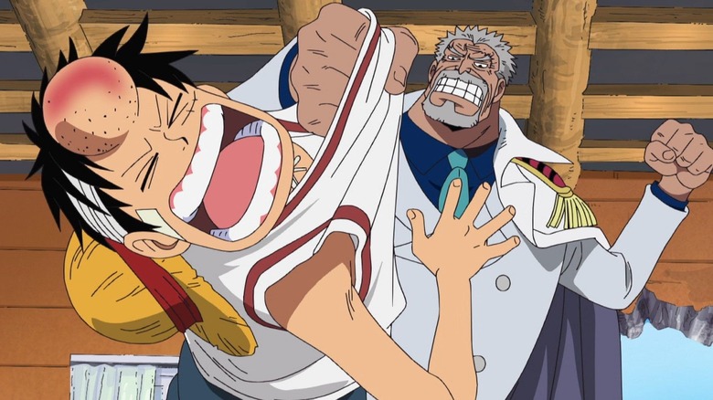 Garp punches Luffy in the head so hard he gets a giant gump in One Piece