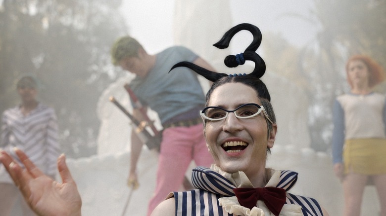 Mr. 3 laughs while Nami, Vivi, and Zoro get trapped in wax in One Piece