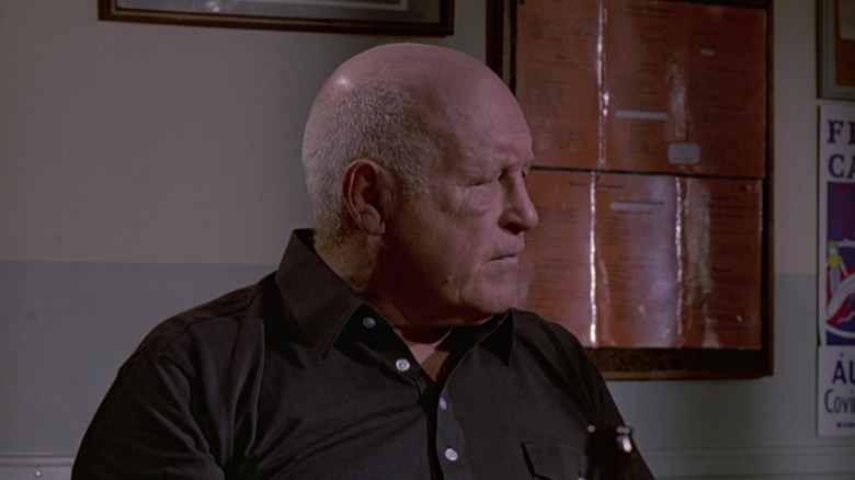 Mobster Joe Cabot listening sternly in Reservoir Dogs