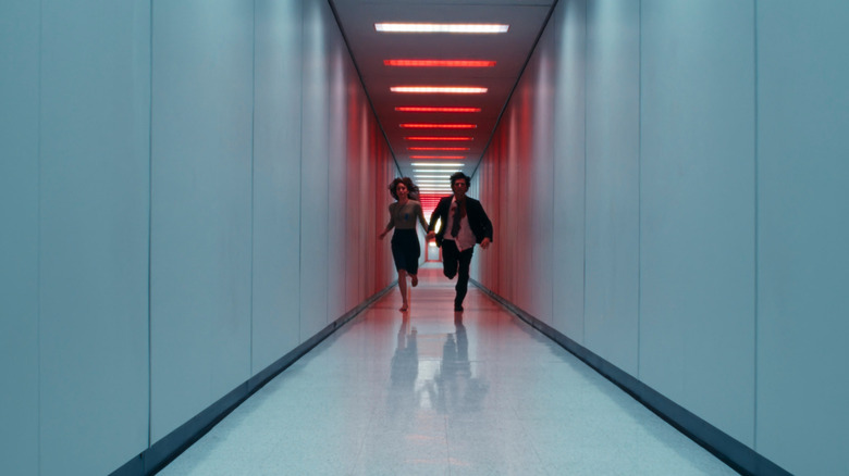 Helly and Mark running down the hallway of the severed floor in Severance