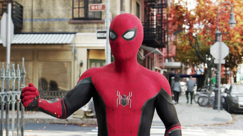 Tom Holland as Spider-Man stands on a New York street in Spider-Man: No Way Home