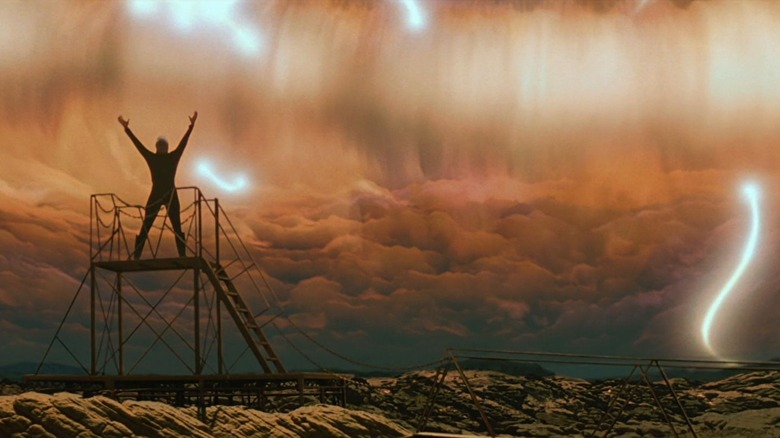 Dr. Soren, his arms raised, welcoming the coming of the Nexus. A scene from Star Trek: Generations.