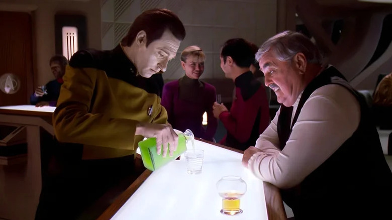 Data pouring Scotty a drink in Ten-Forward on Star Trek: The Next Generation