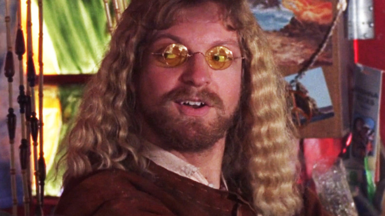 Alex Zahara's Michael Clark looks off to his right while driving a van in Stargate SG-1