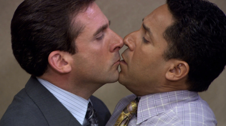 Steve Carell's Michael Scott kisses Oscar Nunez's Oscar Martinez in The Office