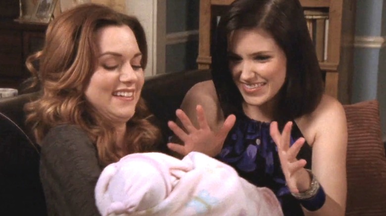 Hilarie Burton Morgan's Peyton Sawyer hands Sophia Bush's Brooke Davis a baby in One Tree Hill