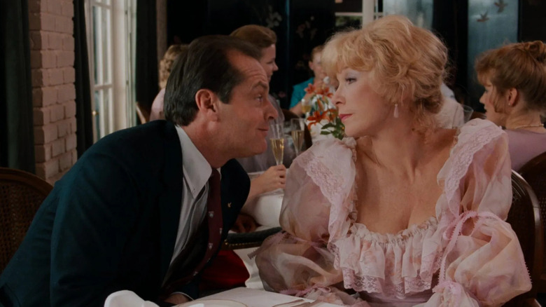 Garrett leaning in to talk to Aurora in Terms of Endearment