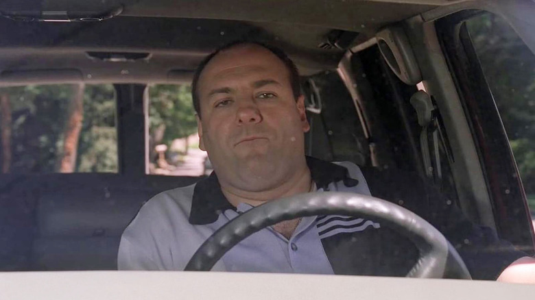 Tony drives his car down the street to the Sopranos