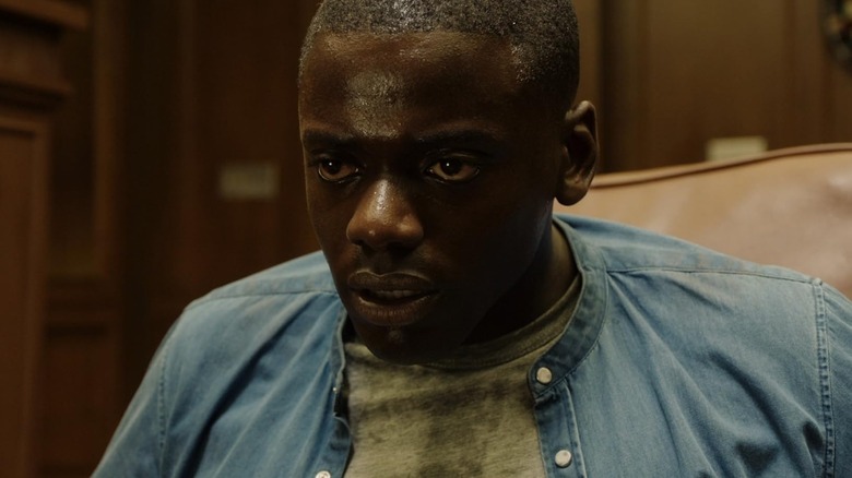 Daniel Kaluuya as Chris looking scared and sweaty in Get Out