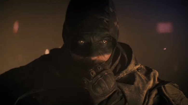 A super soldier pulls up his mask in Onslaught