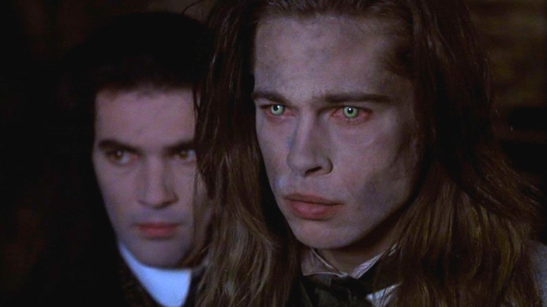 Antonio Banderas as Armand and Brad Pitt as Louis looking very dirty and disheveled in Interview with the Vampire